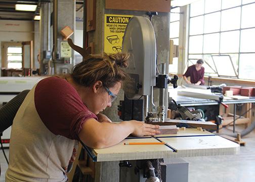 Students make furniture art with machinery