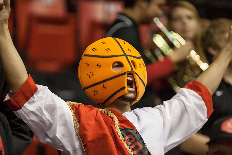 A member of The Show, SDSUs famed student section, cheers during a basketball game in the 2016-17 season.