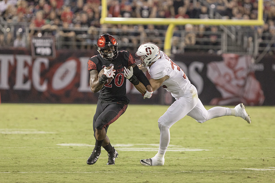Senior running back Rashaad Penny powers through a tackle during SDSUs 20-17 win over Stanford.