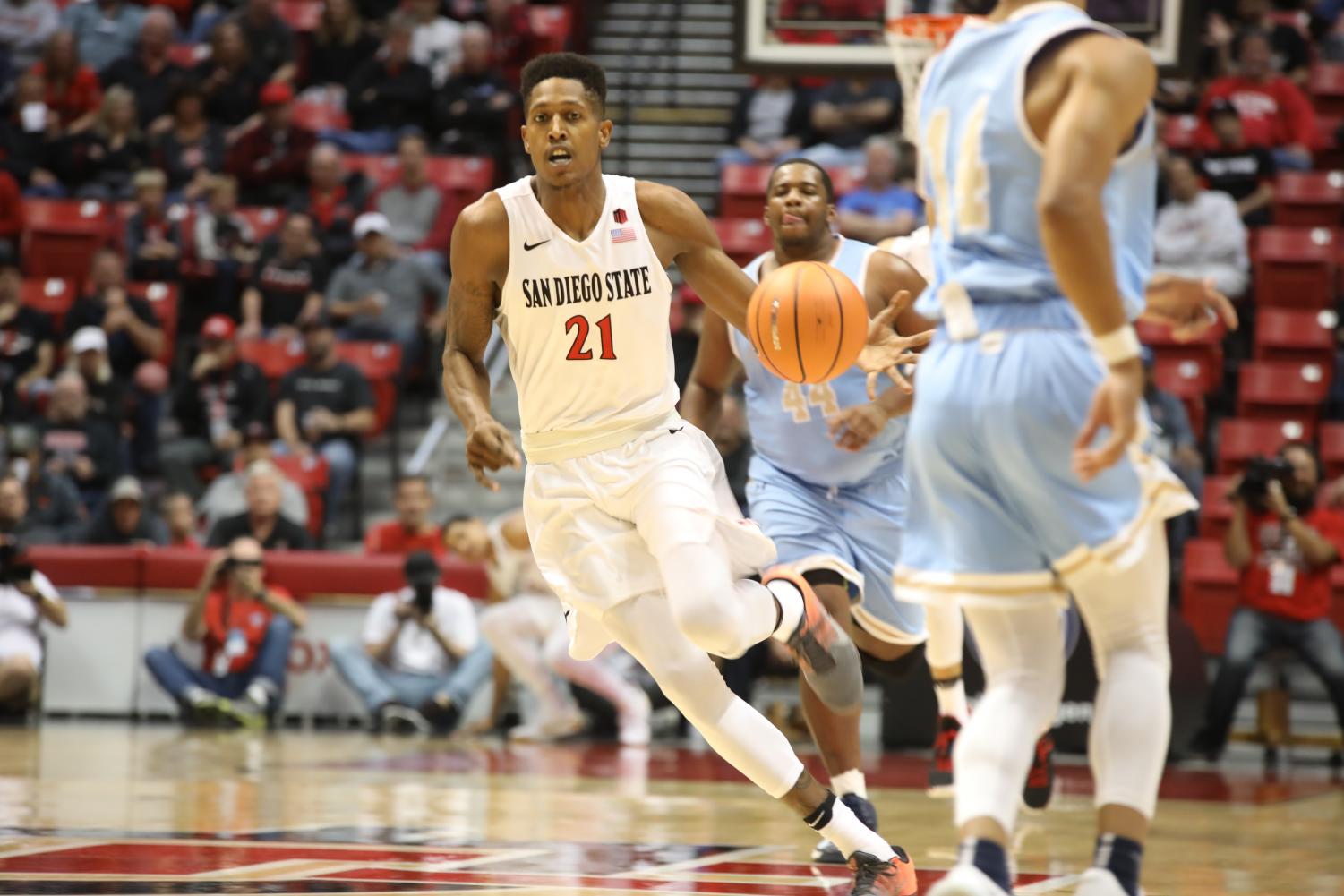 Senior forward Malik Pope runs in transition during SDSU's 91-52 opening game win over San Diego Christian.