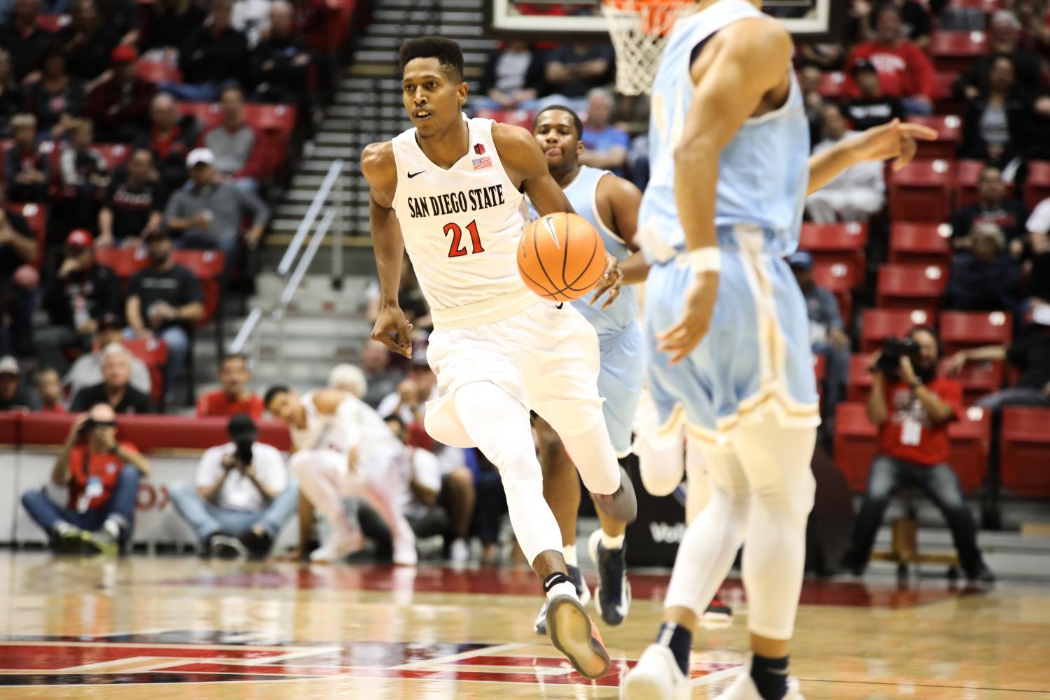 Back in Red and Black: Senior forward Malik Pope runs the court during the Aztecs 91-50 win over San Diego Christian on Nov. 10 at Viejas Arena
