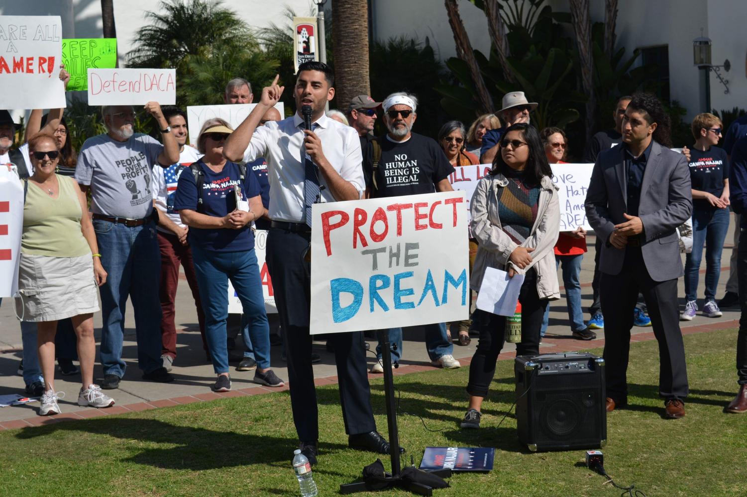 Congressional candidate Ammar Campa-Najjar addresses a crowd at a rally for immigrant rights Friday in front of Hepner Hall.