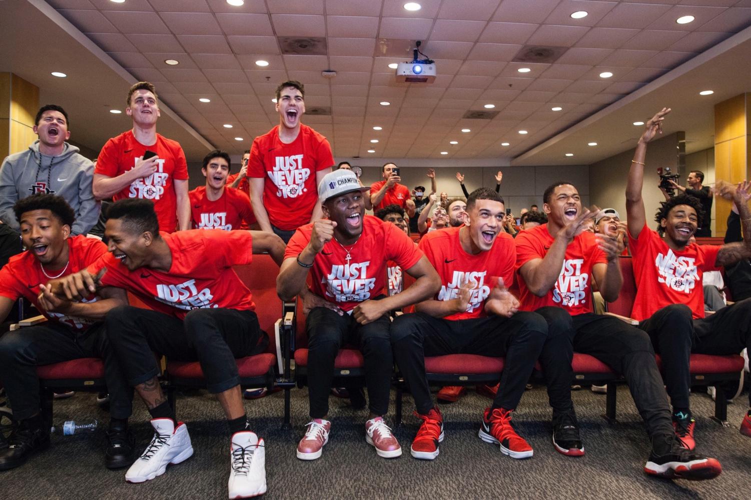 Members of the San Diego State men's basketball team react to the teams 11 seed in the upcoming NCAA Tournament at the Fowler Athletic Center on March 11. The Aztecs will play No. 6 seed University of Houston in the Round of 64 on March 15 in Wichita, Kansas.