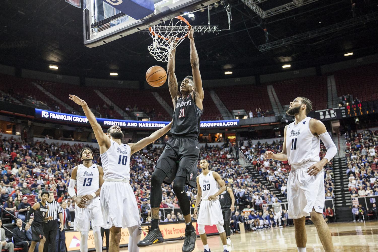 Malik Pope dunks the ball during the Aztecs 90-73 victory over Nevada on March 9 at the Thomas & Mack Center.