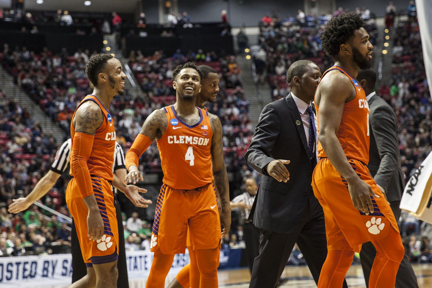 Redshirt junior guard Shelton Mitchell smiles with his teammates during Clemson's 84-59 victory over Auburn on March 18 at Viejas Arena.