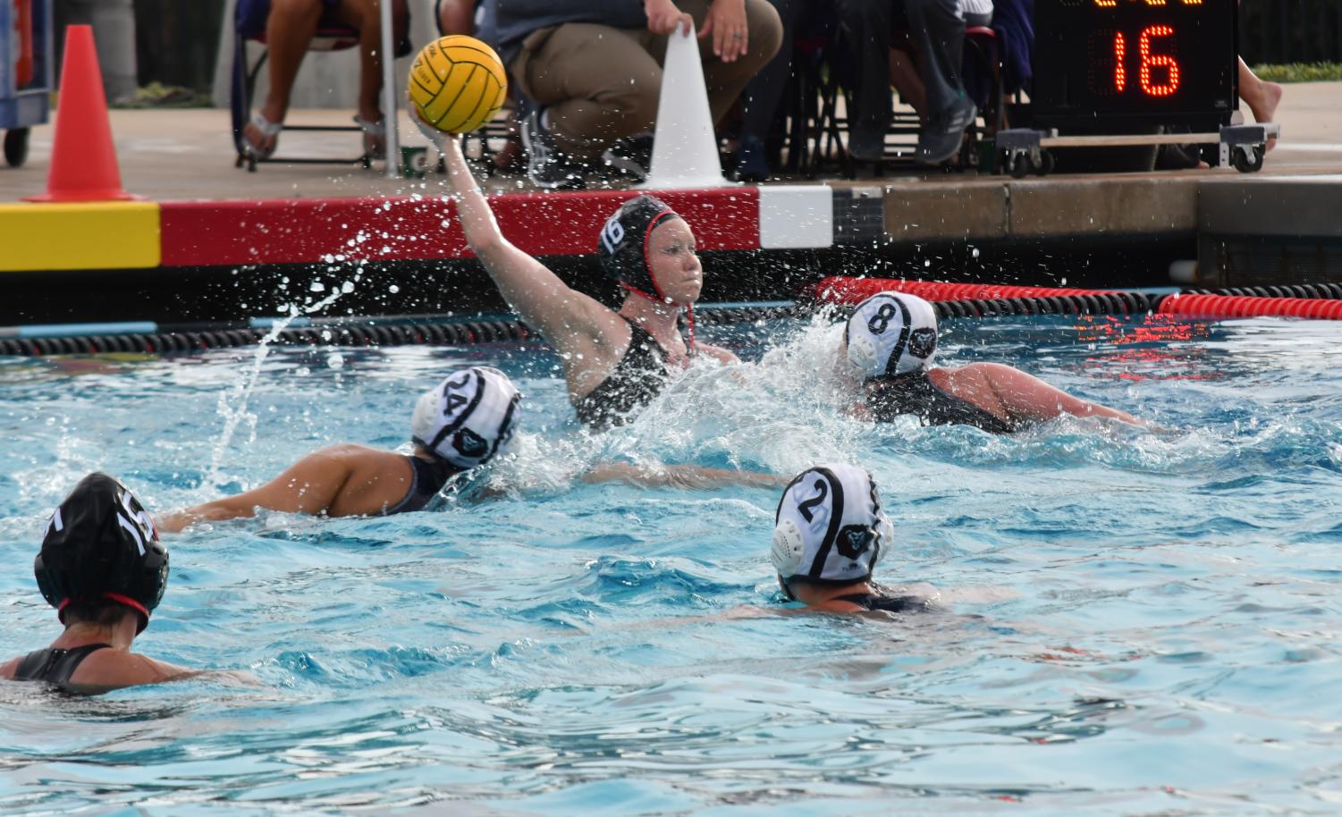 Senior utility player Lizzy Bilz prepares to take a shot on goal during the
Aztecs home game against Loyola Marymount University on March 9 at the Aztec Aquaplex.
