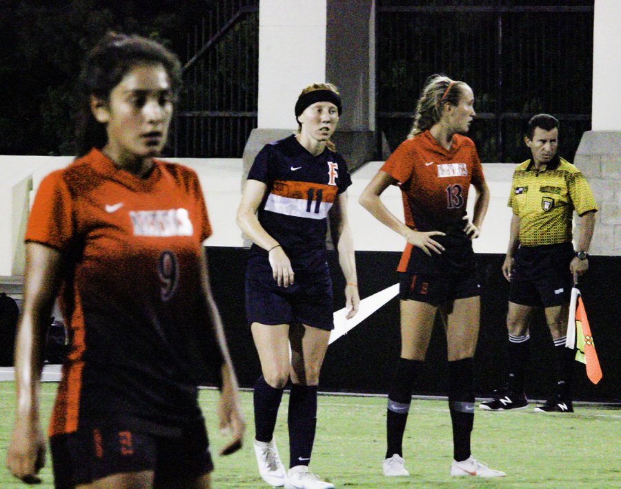 (left to right) Aztecs freshman midfielder Laura Fuentes, CSUF sophomore midfielder Haley Brown and SDSU freshman defender Lauren Dicus stand on the pitch during a break in the action of an exhibition match on Aug. 10 at the SDSU Sports Deck. The Aztecs lost the match 2-1. 