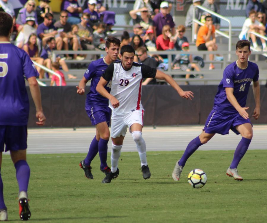 Then-junior midfielder AJ Valenzuela chases after the ball during the Aztecs 2-1 loss to Washington on Oct. 7, 2018 at the SDSU Sports Deck.