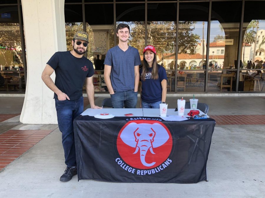 Members of the San Diego State College Republicans table outside Malcom A. Love Library.