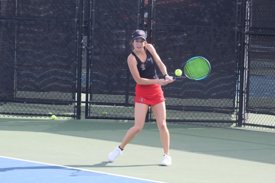 Sophomore Abbie Mulbarger  hits the ball during the Aztecs 7-0 victory over Sacramento State at the Aztec Tennis Center on Jan. 20. 