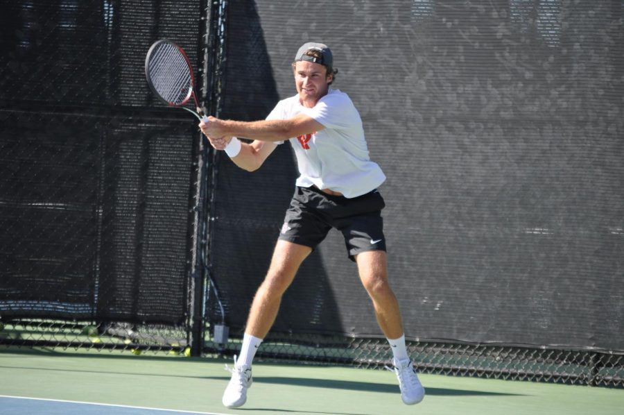 Senior Sander Gjoels-Anderson swings his racket during the Aztecs 4-1 loss to Harvard on March 22 at the Aztec Tennis Center.
