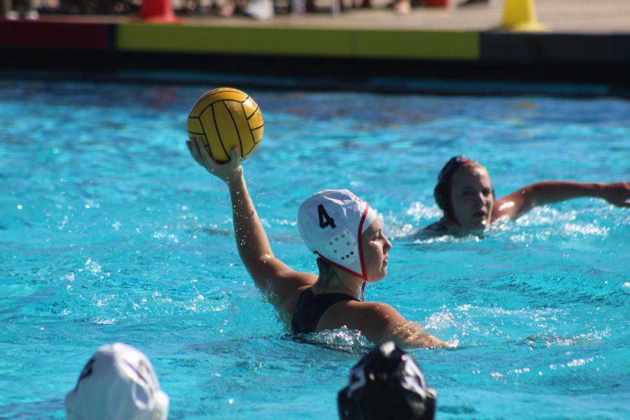 Sophomore utility Maddie Higginson handles the ball during the Aztecs 12-9 loss to the SDSU alumni at the Aztec Aquaplex on Jan. 26. 