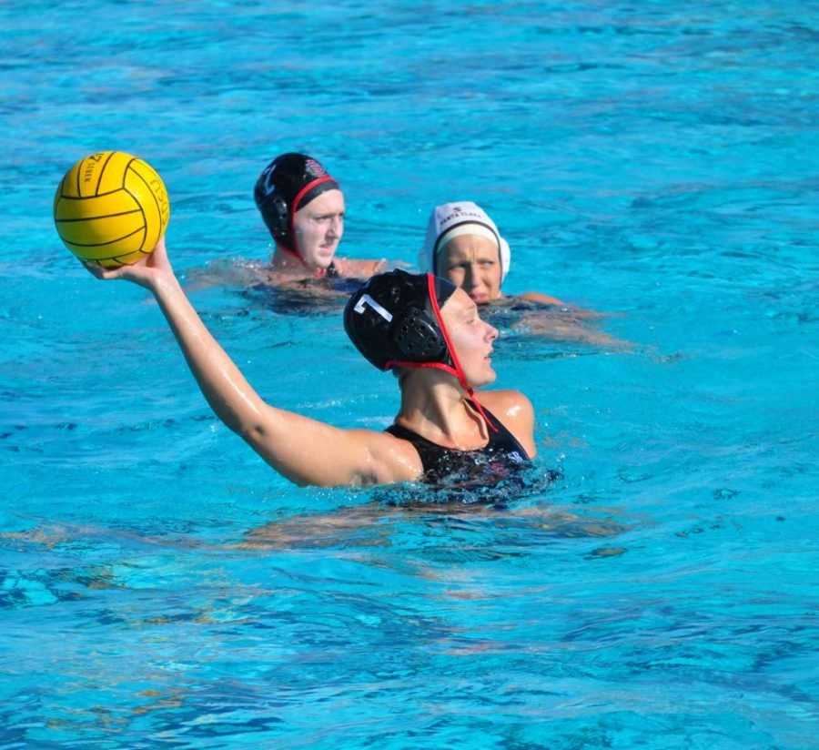 Junior utility player Shelby Kraft looks to pass during the Aztecs 4-1 victory over Santa Clara on March 28 at the Aztec Aquaplex.
