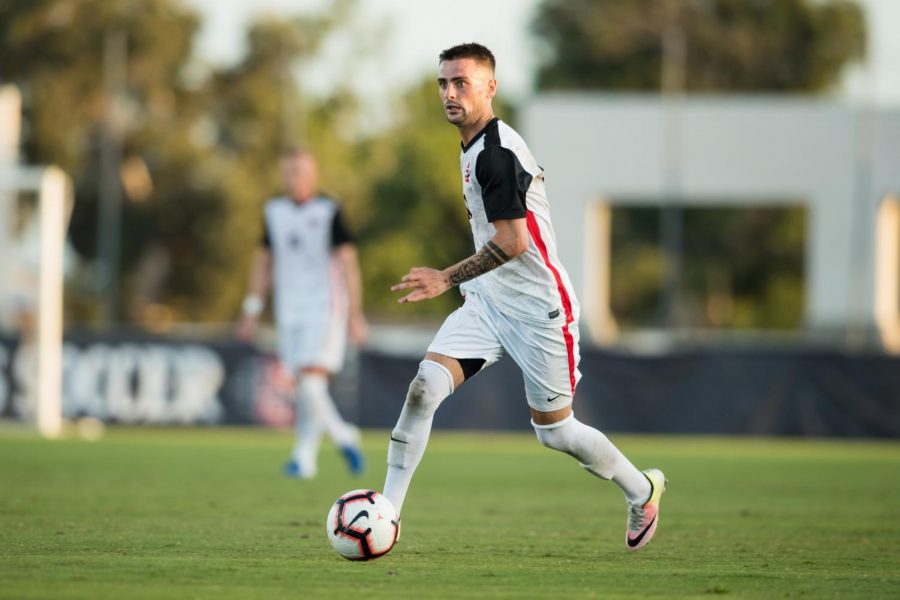 Junior midfielder Keegan Kelly dribbles the ball up the field during the Aztecs’ 3-2 loss against the Detroit Mercy Tigers on Sept. 9 at the SDSU Sports Deck.