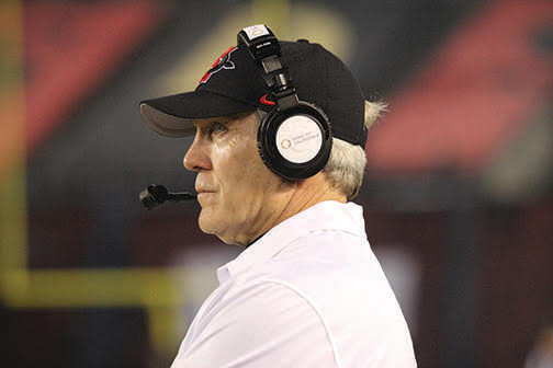 Head coach Rocky Long stands on the sideline during an SDSU football game.