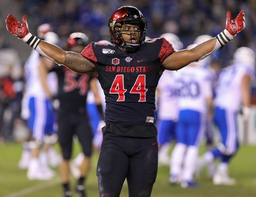Senior linebacker Kyahva Tezino reacts after a play during the Aztecs 13-3 victory over BYU on Nov. 30