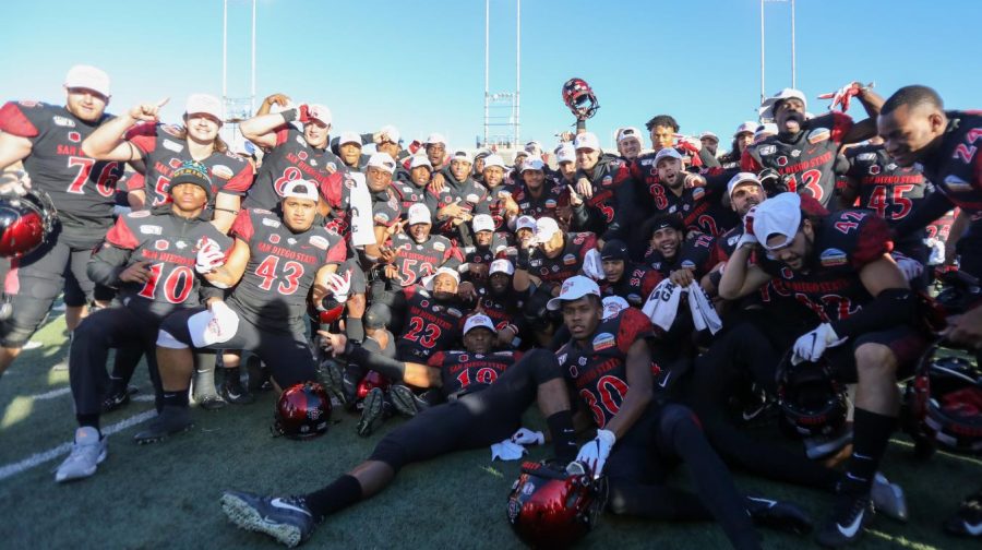 The Aztecs celebrate with their bowl championship hats after their 48-11 victory over Central Michigan on Dec. 21 at Dreamstyle Stadium in Albuquerque, New Mexico.