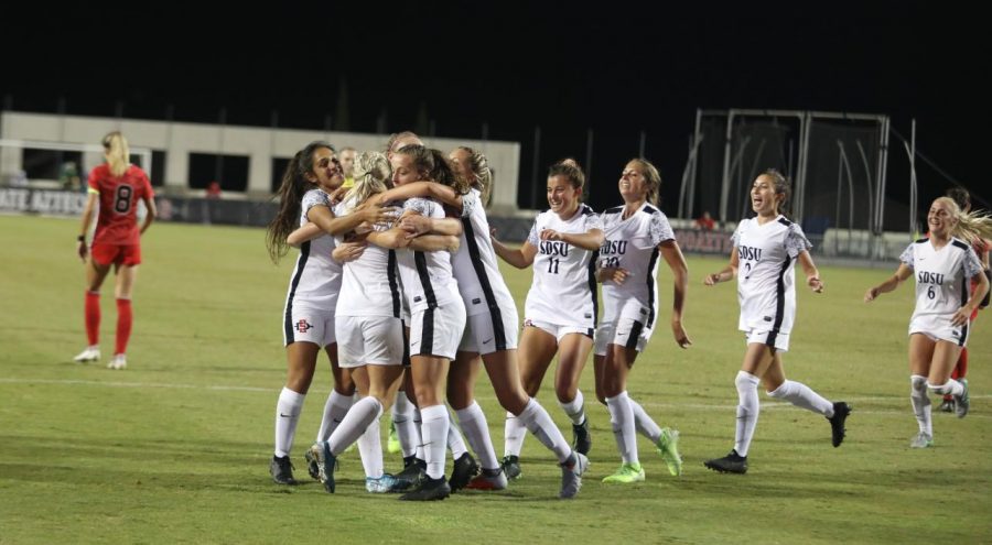 The San Diego State women’s soccer team celebrates after scoring a goal during the Aztecs’ 1-0 win on Oct. 4, 2019 at the SDSU Sports Deck.