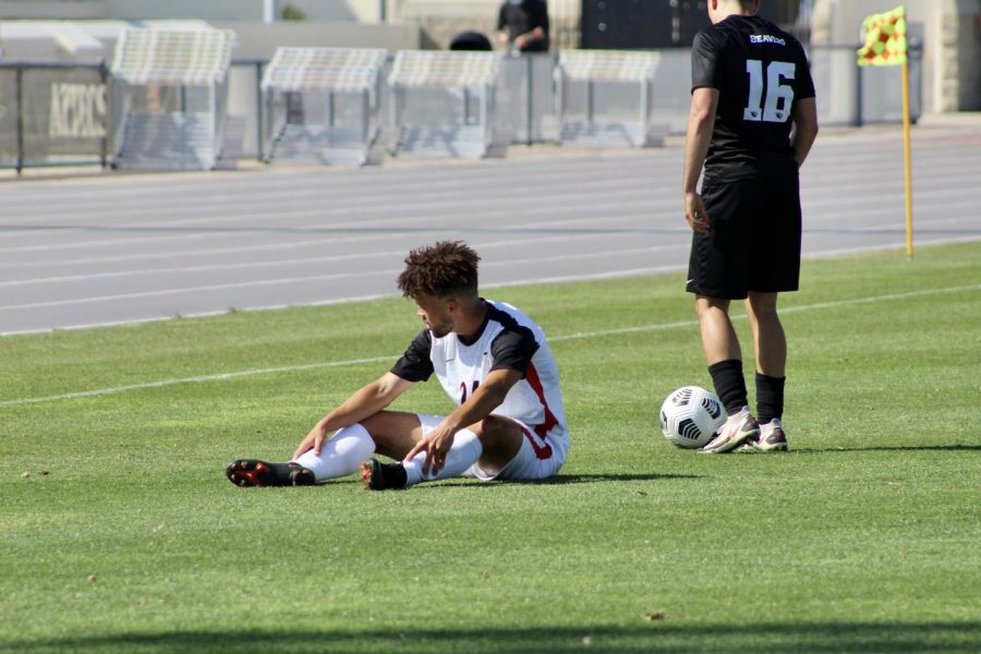 San Diego State mens soccer freshman midfielder Bryson Hankins sits down after a foul during the Aztecs 4-0 loss to Oregon State on April 17, 2021 at the SDSU Sports Deck.