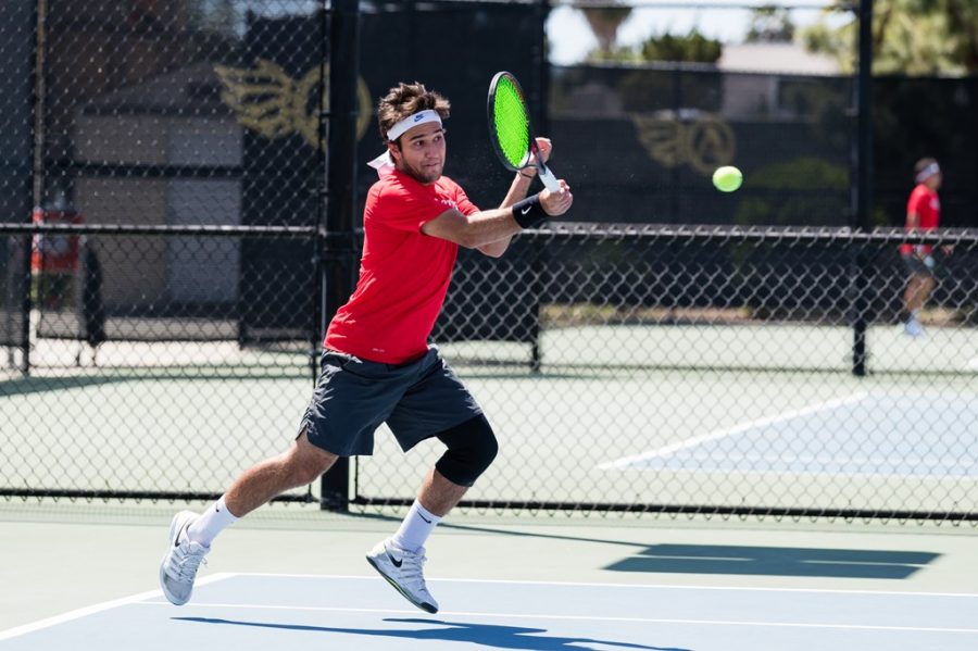 San+Diego+State+mens+tennis+sophomore+Victor+Castro+connects+with+the+ball+during+the+Aztecs+4-2+loss+to+Santa+Clara+on+April+19%2C+2021+at+the+Aztec+Tennis+Center.