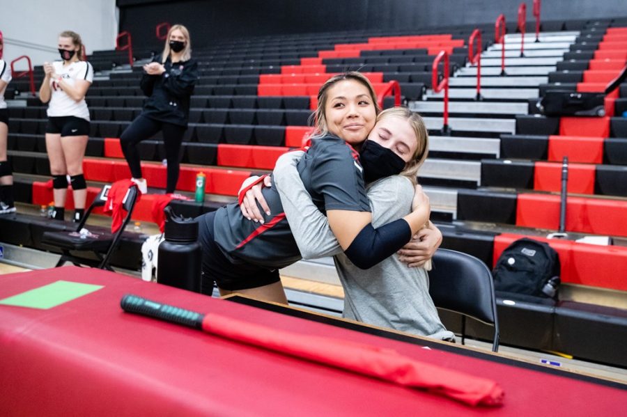 San Diego State volleyball senior libero Lauren Lee (left) hugs senior Camryn Machado during Senior Day festivities before the Aztecs 3-0 win over Colorado State on April 3, 2021 at Peterson Gym.