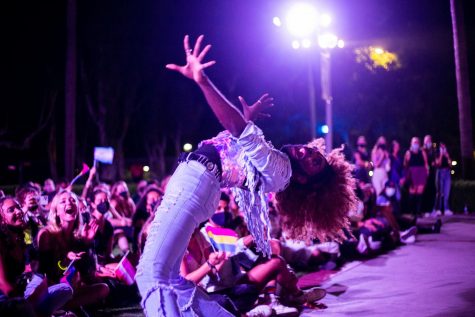 Amber St. James performing on stage in front of Hepner Hall during 2021 Dragstravaganza.