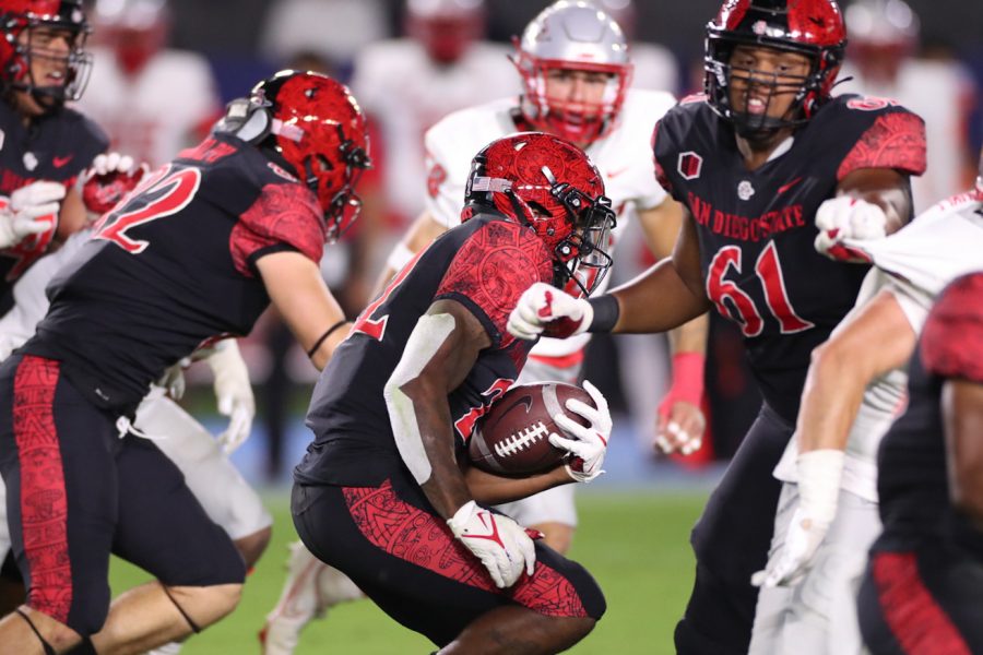 Senior running back Greg Bell carries the football against the New Mexico Lobos on