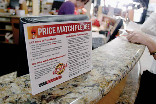 Price Match Pledge sign in the SDSU bookstore. Photo by Monica Linzmeier, Photo Editor 