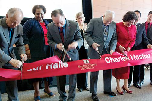 Dean Paul Wong and SDSU President Elliot Hirshman joined Ambassador Charles Hostler in the official ribbon cutting ceremony for the newly opened Charles Hostler Hall. Photo by Chelsea Massey, Staff Photographer