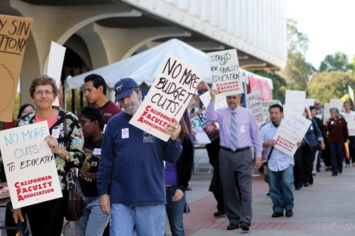 Faculty protest budget cuts in 2012 on the North Library Walkway. File photo.
