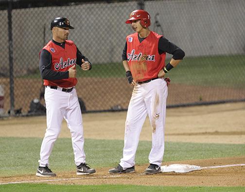 Coach Mark Martinez speaks with Steven Pallares