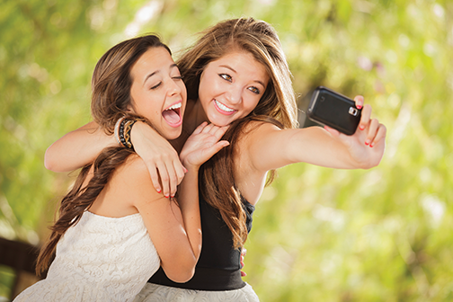 Attractive Mixed Race Girlfriends Taking Self Portrait with Came
