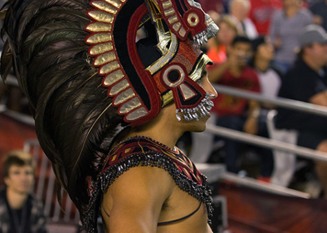 Aztec Warrior mascot at a sports event. 