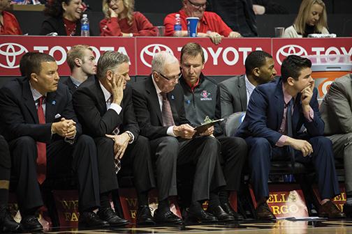 SDSU basketball coaches talk on bench