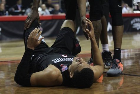 Junior guard Trey Kell grimaces in pain after a hard foul.