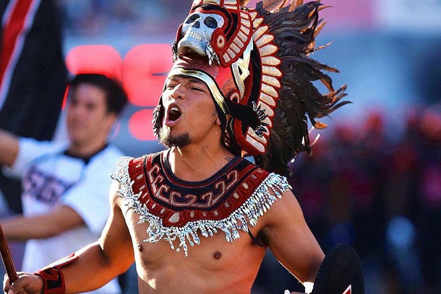 A man portrays the Aztec Warrior mascot at a sporting event in spring 2017.
