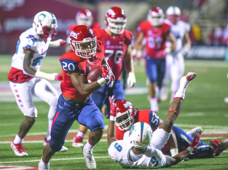 Freshman running back Ronnie Rivers separates from the defense during Fresno State’s 38-0 win over New Mexico on Oct. 14. SDSU faces Fresno on Oct. 21 at SDCCU Stadium.