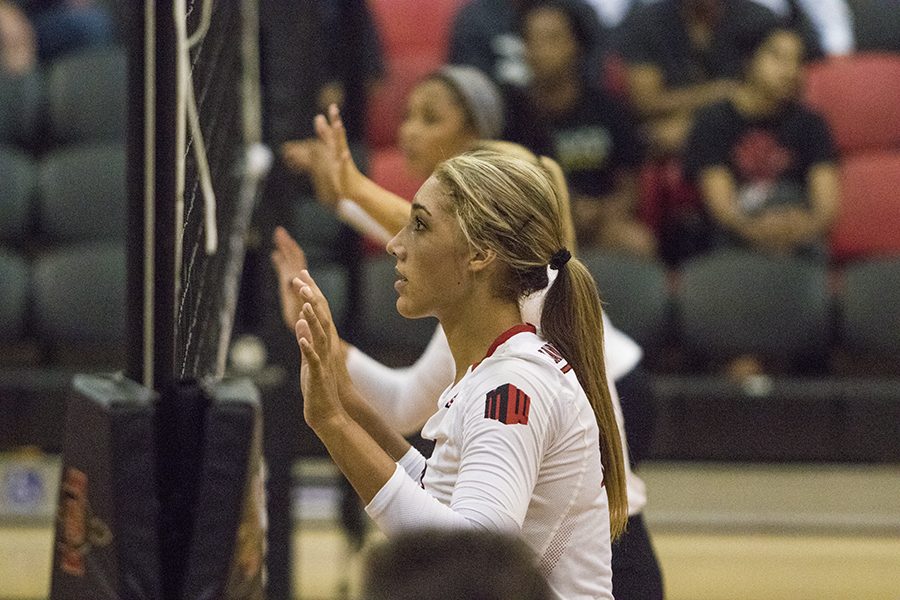 Senior hitter Alexis Cage stands ready at the net during SDSUs loss to Loyola Marymount on Sept. 8.