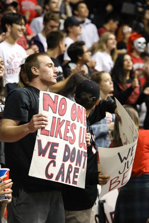 A member of The Show holds up the infamous No one likes us, we dont care sign during SDSUs opening game win over San Diego Christian.