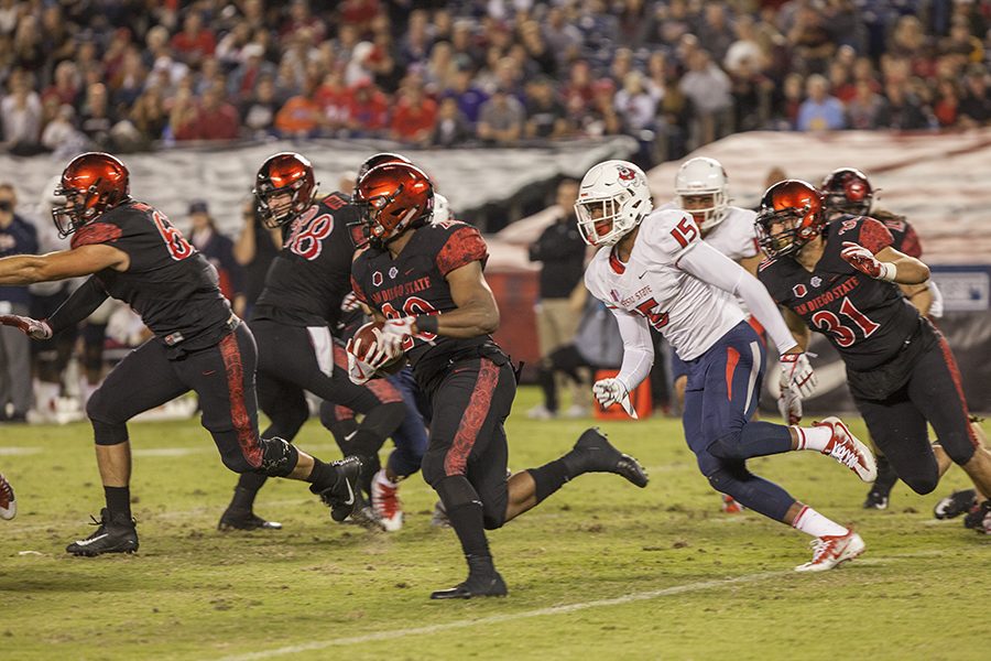 Senior running back Rashaad Penny blows by a Bulldog defender during SDSUs 3-27 loss to Fresno State on Oct. 21.