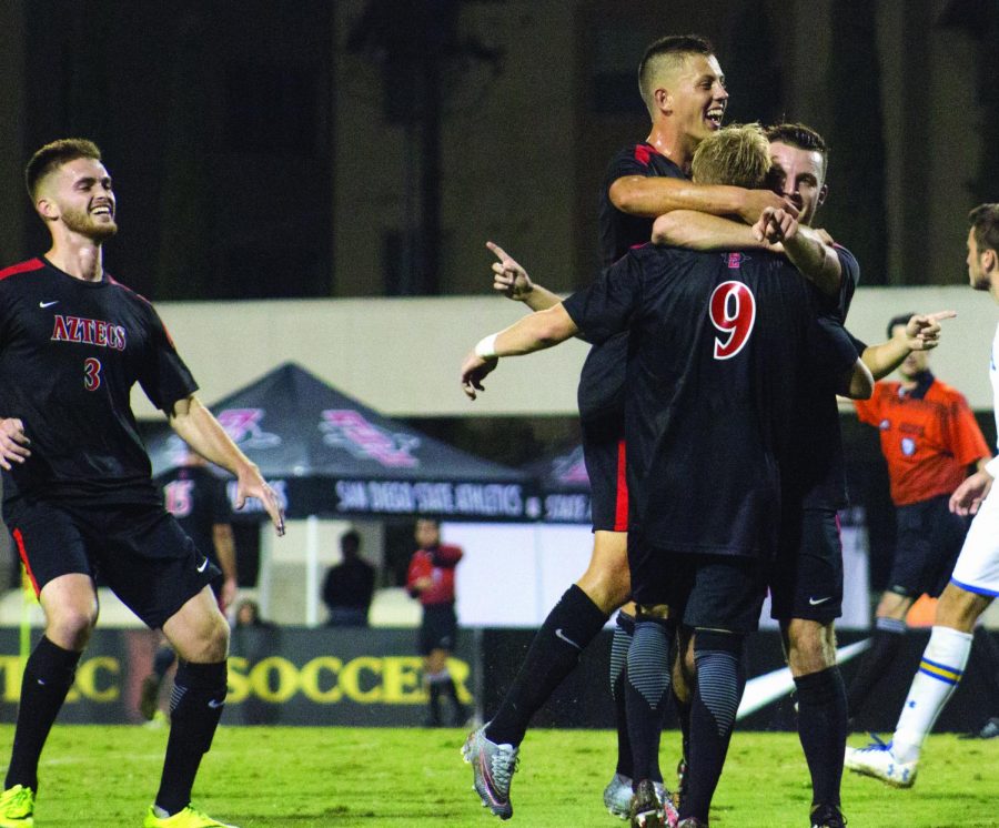 The Aztecs celebrate the third goal of their game against UCLA, shot by senior Winston Sorhaitz with Jeroen Meefout on the assist at the SDSU Sports Deck on Nov. 11, 2017. 