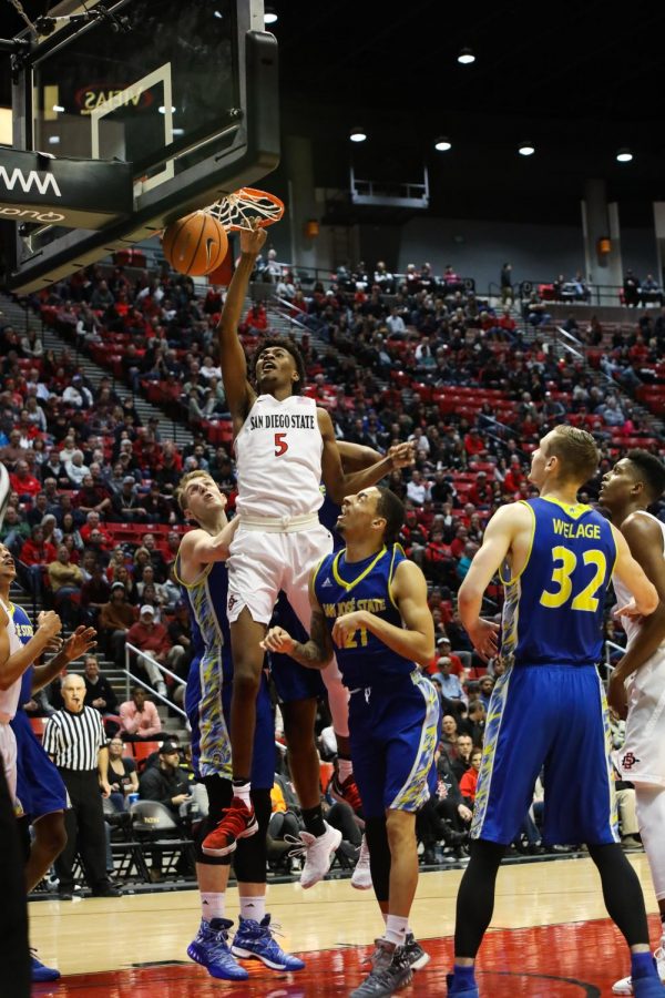 Redshirt freshman forward Jalen McDaniels rises for a dunk during SDSU’s win over San Jose State on Jan. 9.