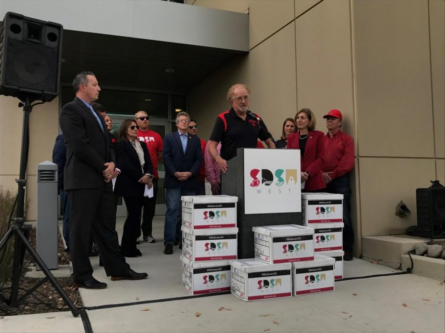 Friends of SDSU steering committee member Bill Hammit speaking at a signature turn-in event at the San Diego County Registrar of Voters office on Tuesday, Jan. 16.