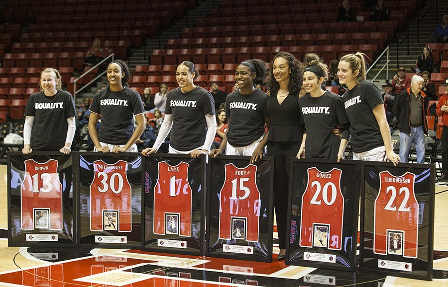 (Left to Right) Allison Brown, Cheyenne Greenhouse, Khalia Lark, McKynzie Fort, head coach Stacie Terry, Geena Gomez and Lexy Thorderson stand with individualized plaques during a pre-game ceremony honoring the teams senior players at Viejas Arena on Feb. 24. 