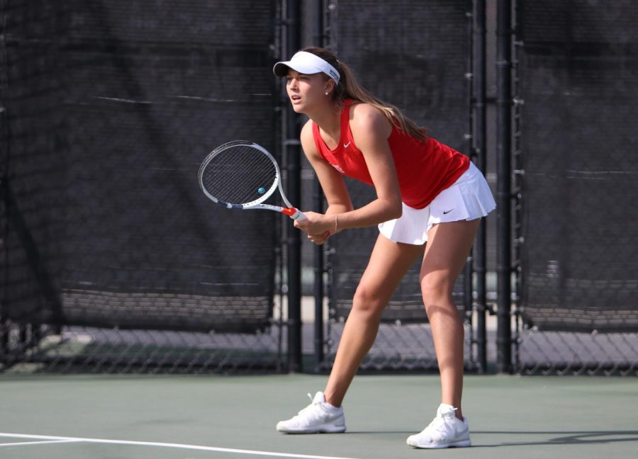 Senior+tennis+player+Jana+Buth+prepares+to+return+service+during+a+match+against+UCSD+on+Jan.+27
