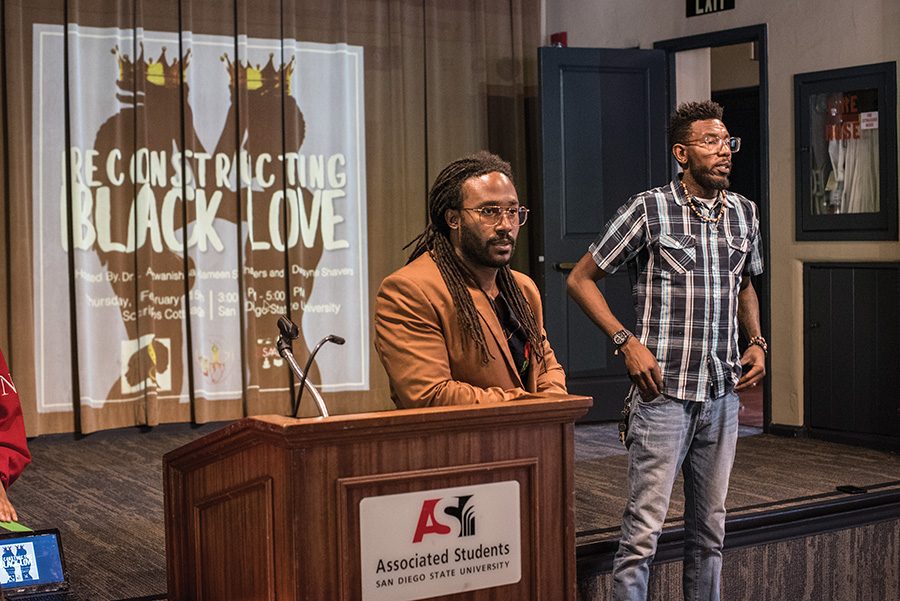 Marriage and family therapy trainee Dwayne Shavers, along with youth advocate Donald Barksdale, address students inside Scripps Cottage for a Reconstructing Black Love forum on Feb. 15.