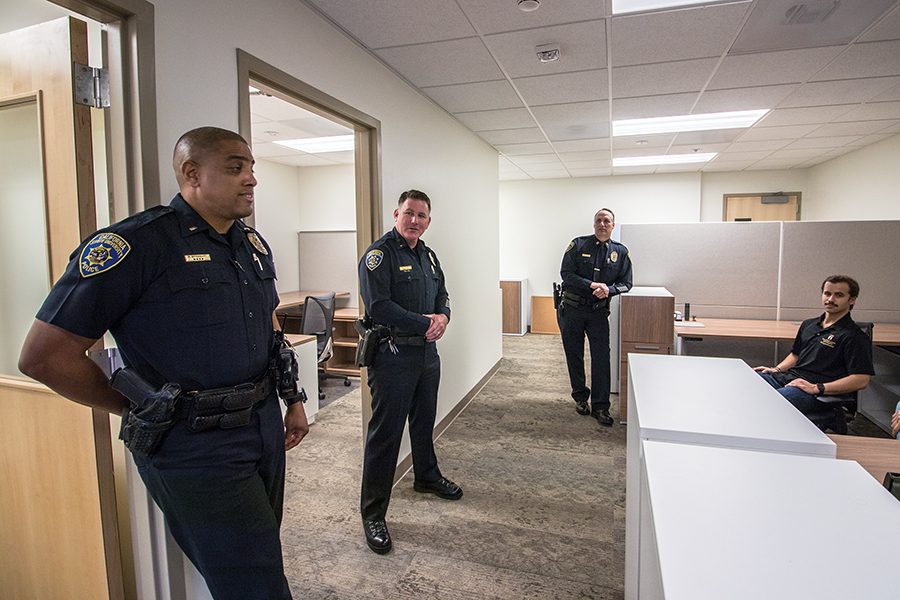 From left to right: SDSUPD Lts. Ronald Broussard, Matthew Conlon and Chuck Kaye, along with Ryan Janics, a student inspection assistant for the Office of Housing Administration, at the police departments new substation Monday.