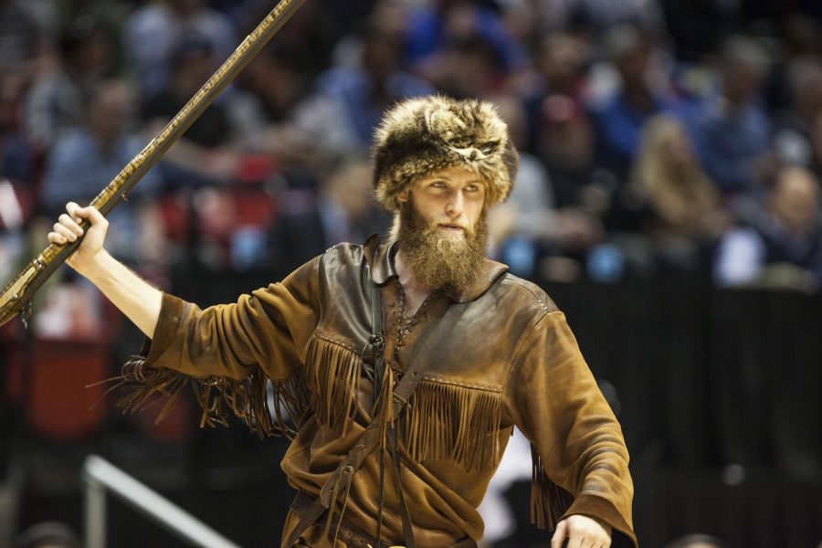 The West Virginia Mountaineer holds up his musket during West Virginias 85-68 victory over Murray State on March 16 at Viejas Arena. 