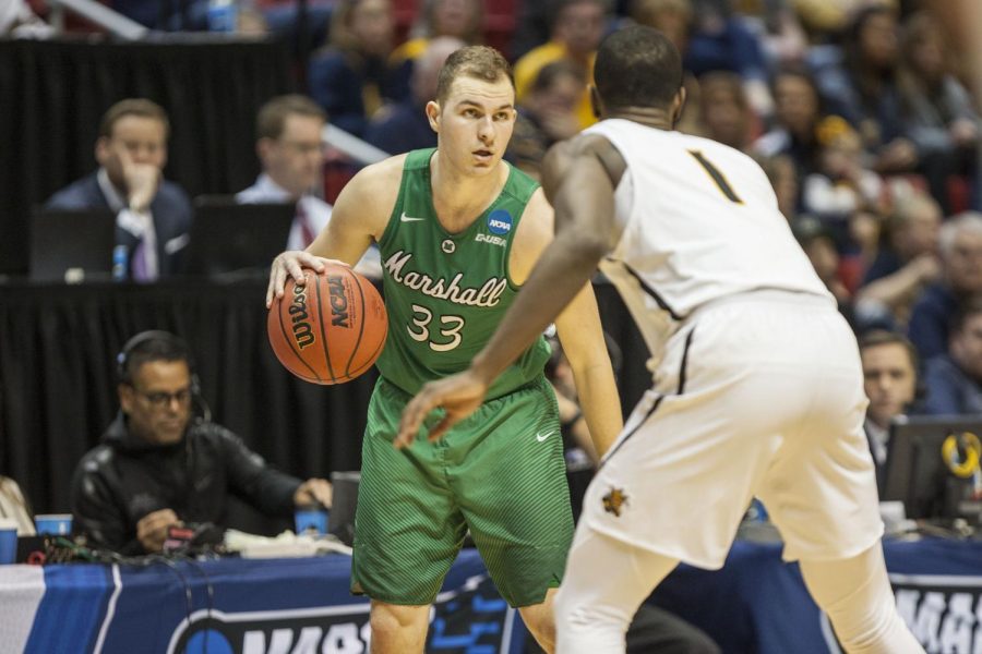Jon Elmore carries the ball during Marshall's 81-75 victory over Wichita State on March 16 at Viejas Arena. 