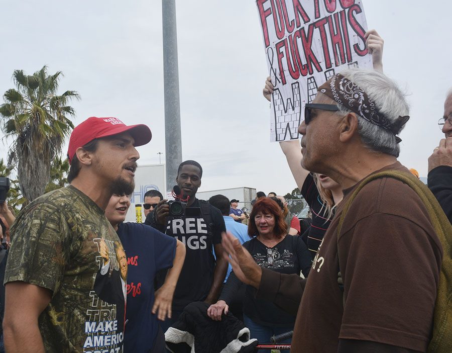 Two protesters argue during President Donald Trumps visit to Otay Mesa on Tuesday.